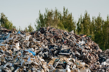 a mountain of metal waste at a metal recycling and collection point