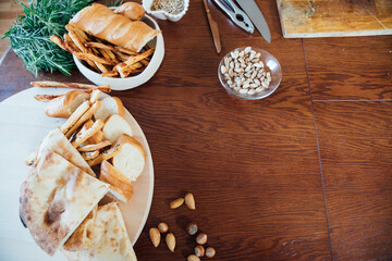 Delicious cooked food with bread on the table as background