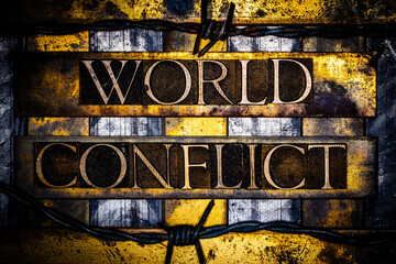 World Conflict text with barbed wire in real authentic typeset letters on vintage textured silver grunge copper and gold background