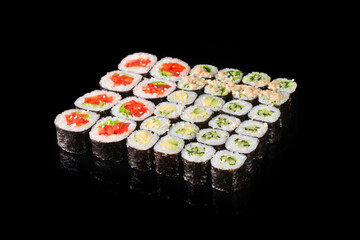 An artistic arrangement of diverse sushi rolls featuring fresh ingredients, each piece showcasing vibrant colors and meticulous craftsmanship