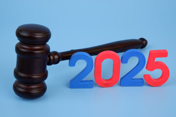 Wooden gavel with numbers 2025. Concept of laws and court in year 2025.