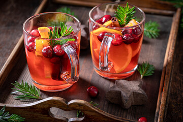 Sweet Christmas punch with orange, cranberry and cinnamon,