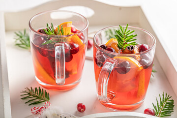 Aromatic Christmas punch in a glass with spices and fruits.