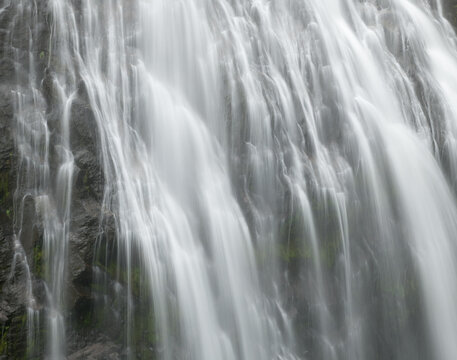 Narada waterfalls with gentle flow in serene natural environment