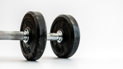 Fototapeta premium A close-up of a weightlifting dumbbell resting on a smooth surface in a well-lit room