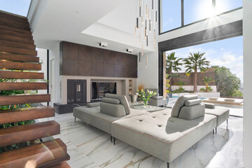 Stylish living room in modern villa overlooking golf course