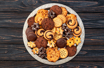 Mix of cookies . Many unhealthy snacks . Top view