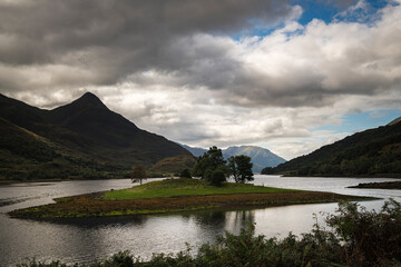 An autumnal HDR image of Loch Leven and Eilean nam Ban near Kinlochleven with the Pap of Glen Coe on the left, lochaber, Scotland. 