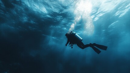 A scuba diver ascends to the surface with a ray of sunlight piercing through the water.