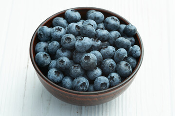 Blueberry photography in a bowl on rustic background