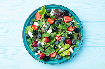 Berries salad (blueberry strawberry blackberry ) with cheese feta and balsamic sauce