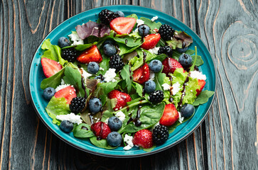 Berries salad (blueberry strawberry blackberry ) with cheese feta and balsamic sauce