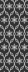 A geometric pattern featuring white floral shapes on a black background, ideal for graphic design and textile applications.