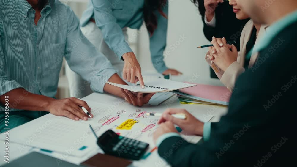 Poster Team of business professionals gathered around a table, engaging in a productive brainstorming session. They're analyzing data and strategizing for success