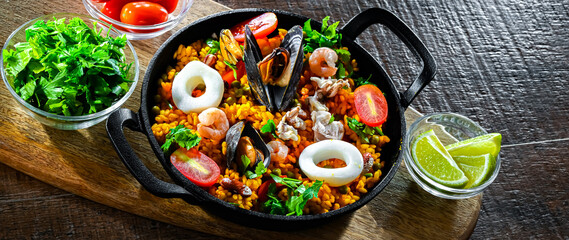 Seafood paella served in a cast iron pan