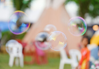 Soap bubbles with view in the amusement park.