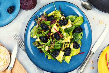 Salad with blackberries, avocado and microgreens.