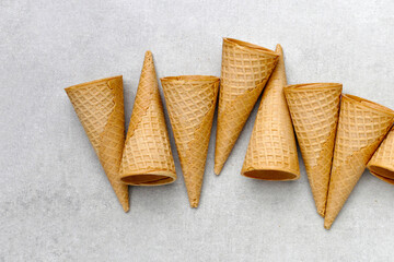 Waffle cones on grey background