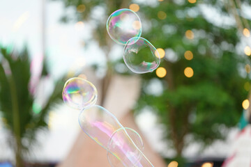 Soap bubbles with view in the amusement park.