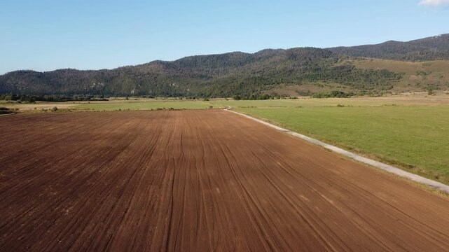 Aerial video of drone flight over agricultural fields. Croatia, Europe