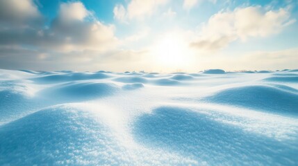Obraz premium A serene winter landscape featuring rolling snow dunes under a bright, sunny sky with scattered clouds, evoking peace and tranquility.