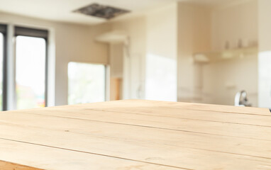 wooden table close up, against wall with warm sunset light from window, table for advertising display your products.