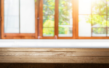 wooden table close up, against wall with warm sunset light from window, table for advertising display your products.