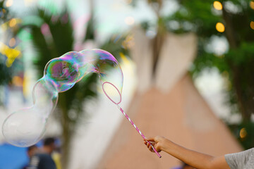 Soap bubbles with view in the amusement park.
