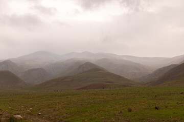 Beautiful green hills in the fog.