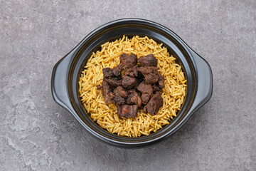 Nasi Kebuli Kambing, Arabian Rice with herb, spices and goat meat topping

