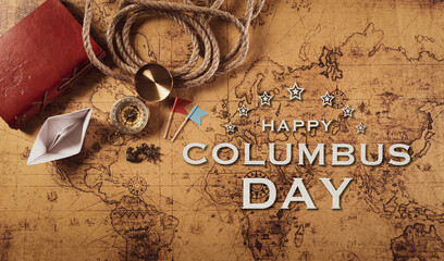 Happy Columbus Day concept. Vintage compass, paper boat, rope on retro treasure manuscript.  Flat lay, top view with copy space.