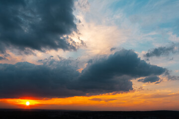 Obraz premium Colourful landscape of beautiful sunset or sunrise with cloudy sky. Natural abstract background.