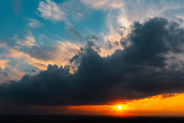 Colourful landscape of beautiful sunset or sunrise with cloudy sky. Natural abstract background.