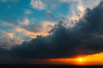 Colourful landscape of beautiful sunset or sunrise with cloudy sky. Natural abstract background.