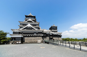 Kumamoto castle, black castle with blue sky and white cloud background