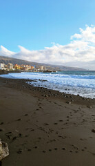 Playa de la Candelaria (or de las Arena) featuring a distinctive black sand of volcanic origin. Tenerife, Canary Islands, Spain, Europe.