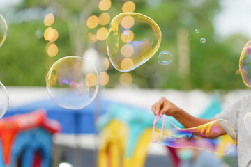Soap bubbles with view in the amusement park.