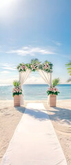 A beach wedding ceremony decor setup with an arch, white linen, and flowers on the sand at sunrise. The vertical backdrop is a blue sky over crystal-clear water. A long white carpet leads to the altar