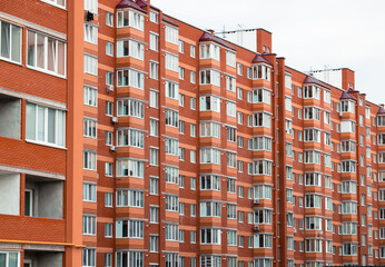 red brick exterior facade long building modern architecture living district isolation city scape...