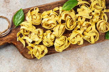 pasta raw tagliatelle with chia seeds dish fresh tasty gourmet food background On the table rustick...