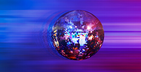 Party disco mirror ball reflecting purple and blue lights