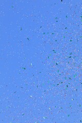 Colorful Confetti against a blue sky