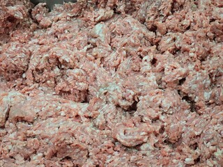 Close-up of raw ground meat texture, perfect for culinary, food industry, and cooking-related projects, providing rustic detail. 