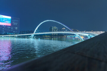 Night lighting of city bridges on the Pearl River in Guangzhou