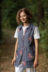 Portrait of a young beautiful girl in the forest.