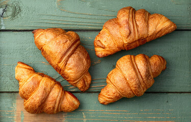 Group of sweet croissant . French morning breakfast . Top view