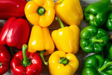 Fresh sweet bell pepper ( paprika ) photography red , green and yellow . Colorful vegetable . Top view