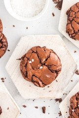 Thick, fudgy brownie cookies stacked with flaky salt