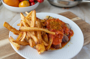 Currywurst with french fries fresh and homemade cooked with delicious curry sauce.