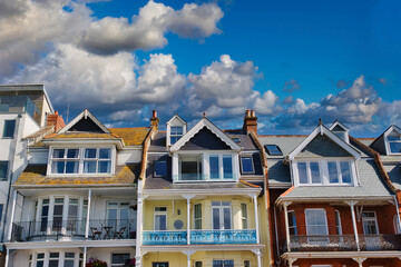 Charming Row of Colorful Houses Under Blue Sky at Towan Beach, Newquay, UK